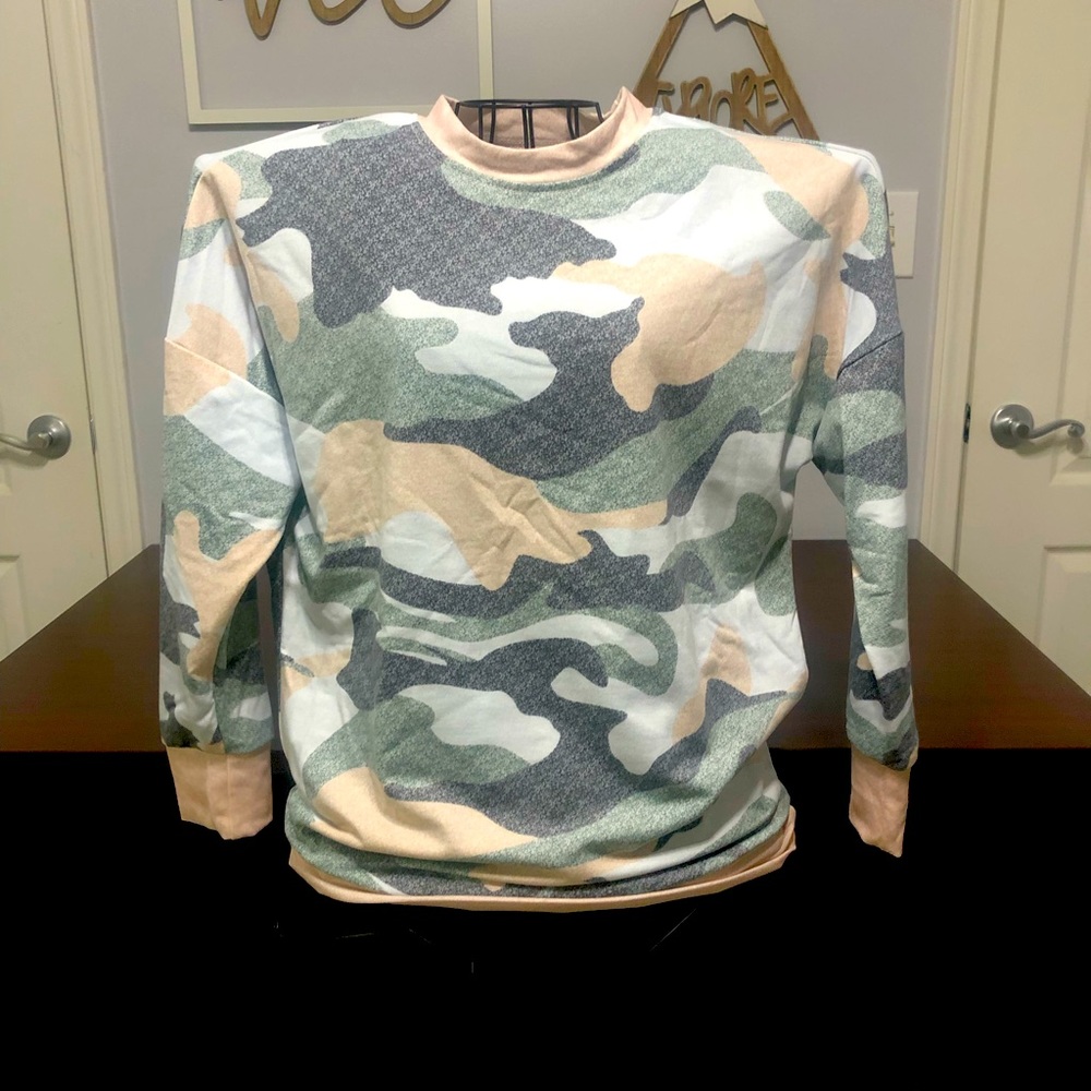 Woman’s camouflage print sweater